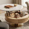 Table basse ronde à plateau relevable.